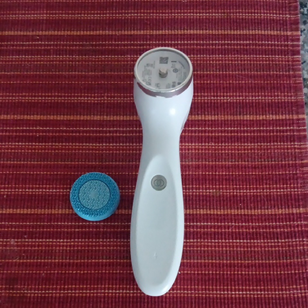 White Skincare Tool with Blue Attachment